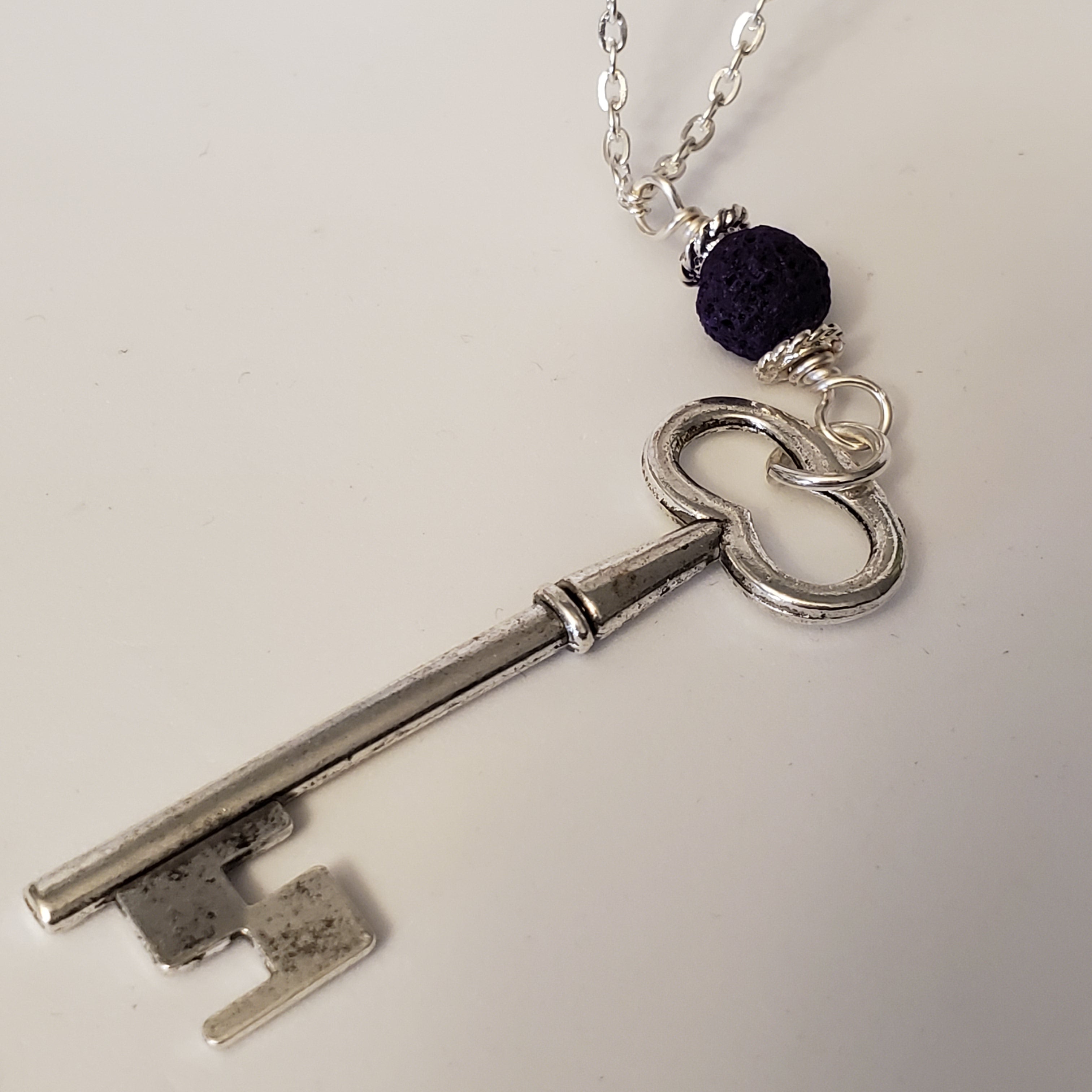 key charm and Purple Lava Bead
