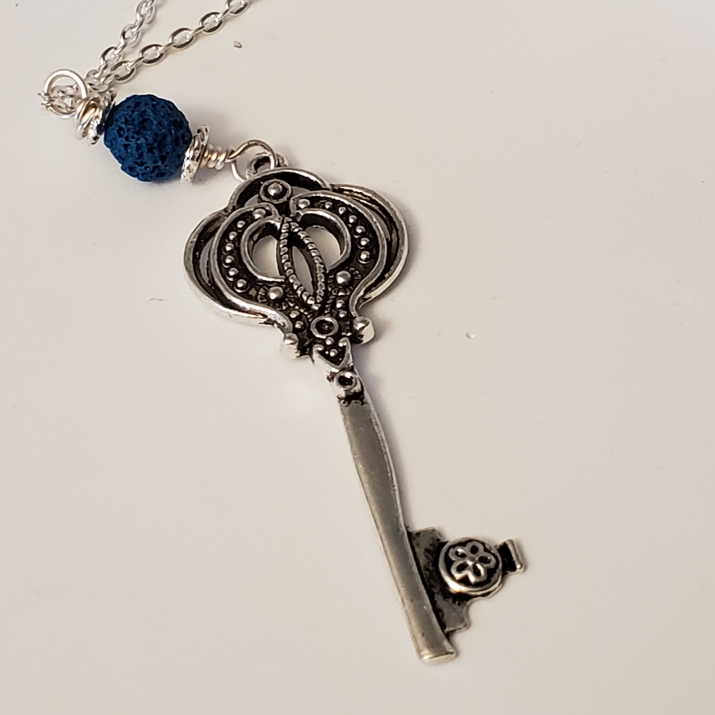 Key charm with a Blue Lava Bead