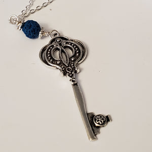 Key charm with a Blue Lava Bead