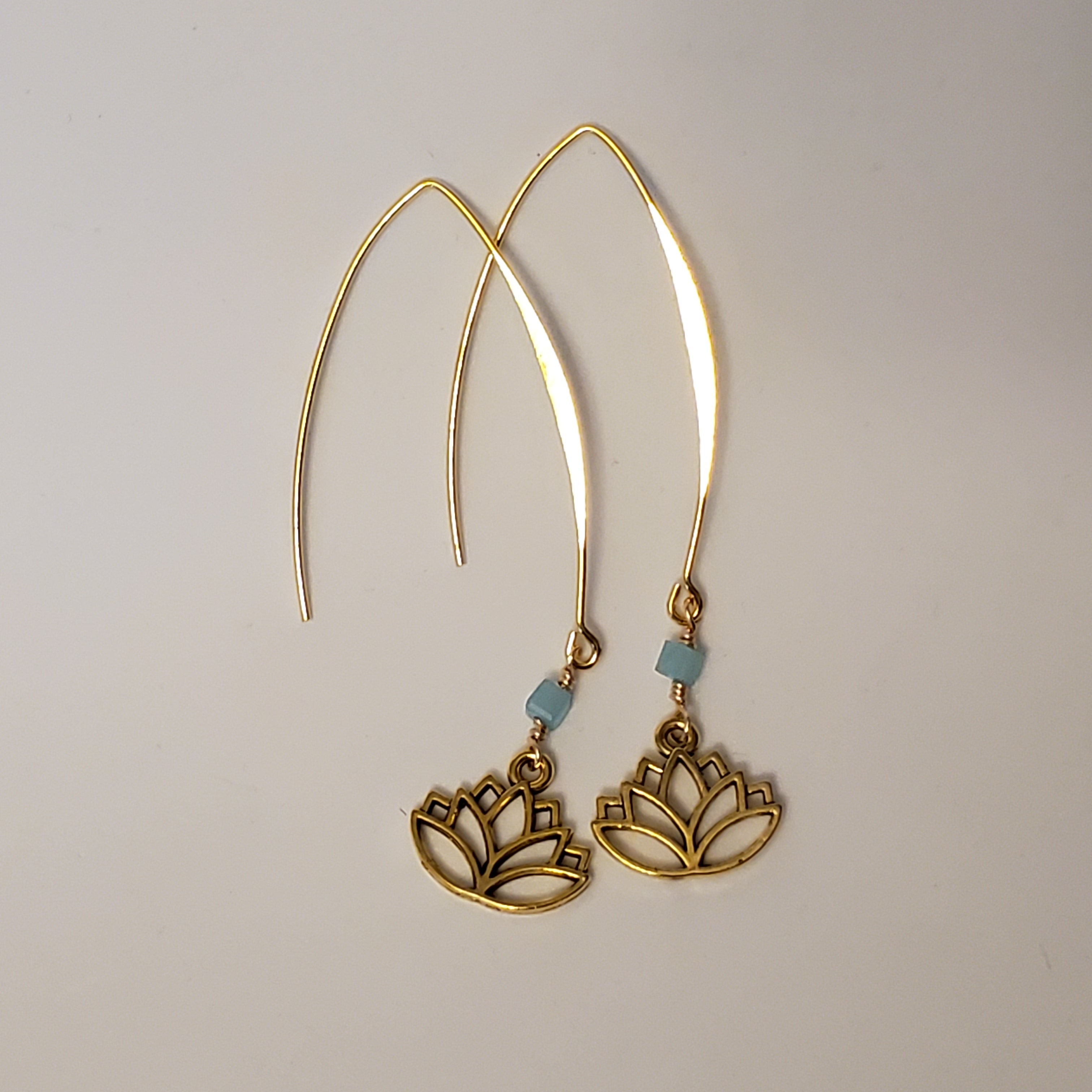 Gold lotus charm drop earrings