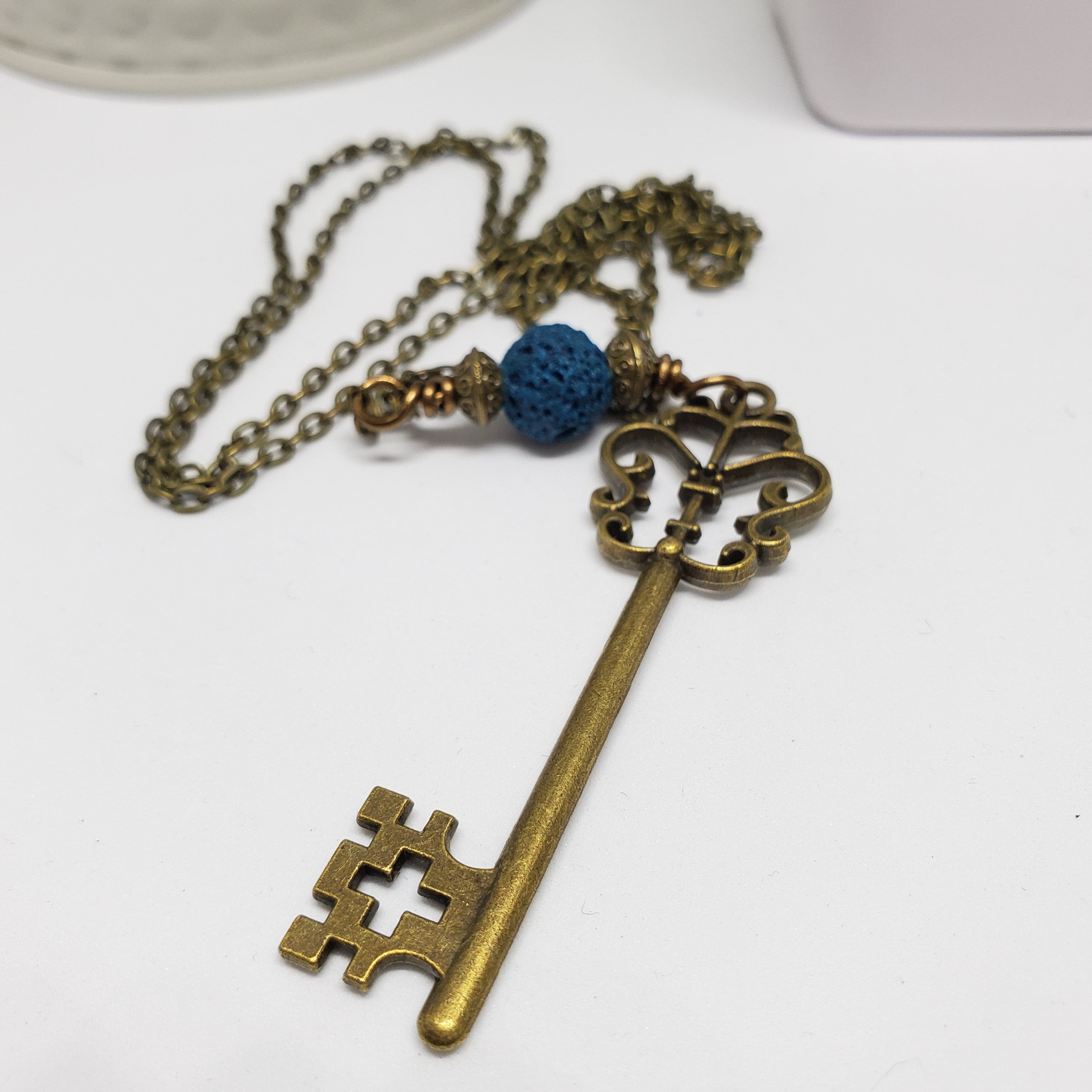 Antique Bronze Key and Blue Lava Bead