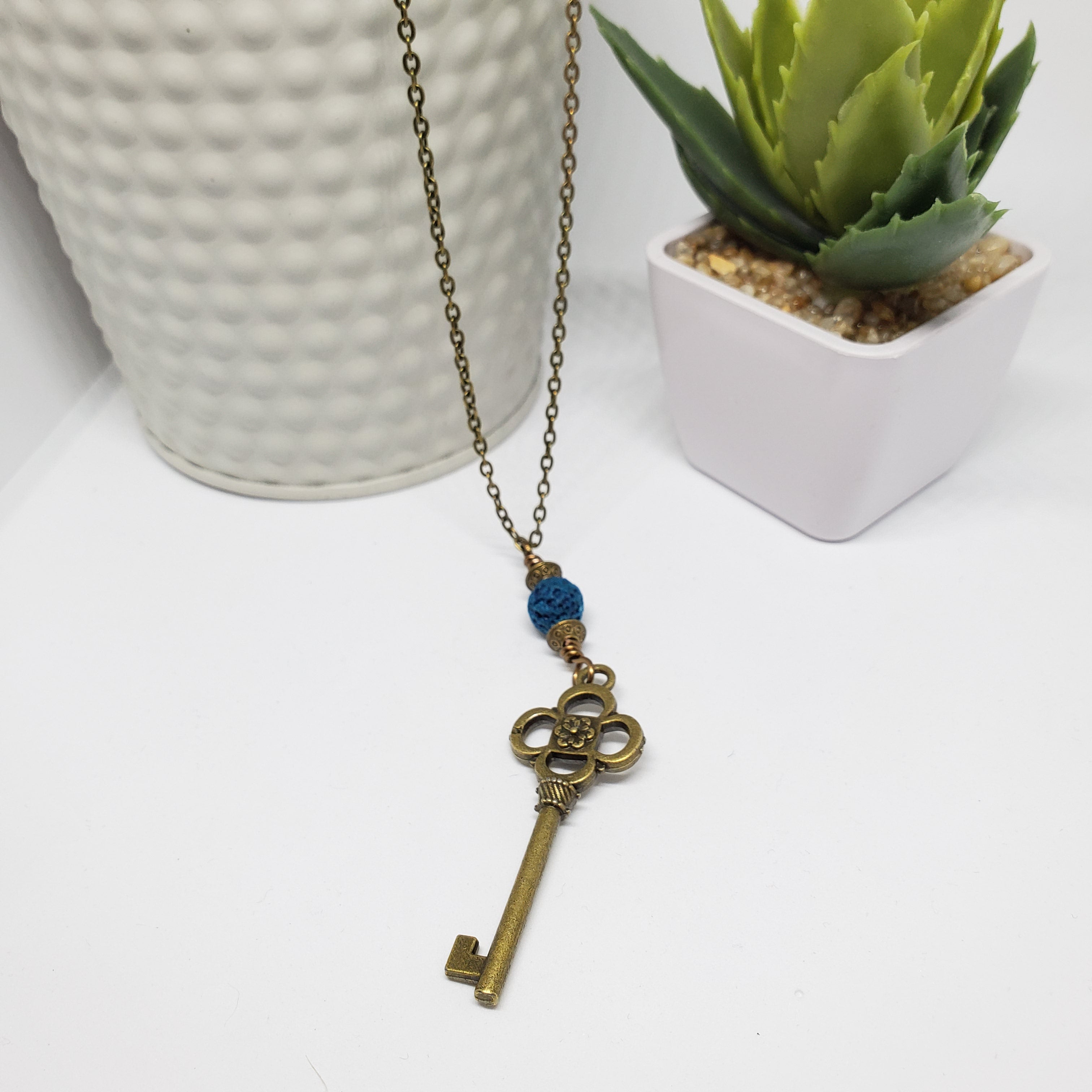 Antique Bronze Key with Blue Lava Bead