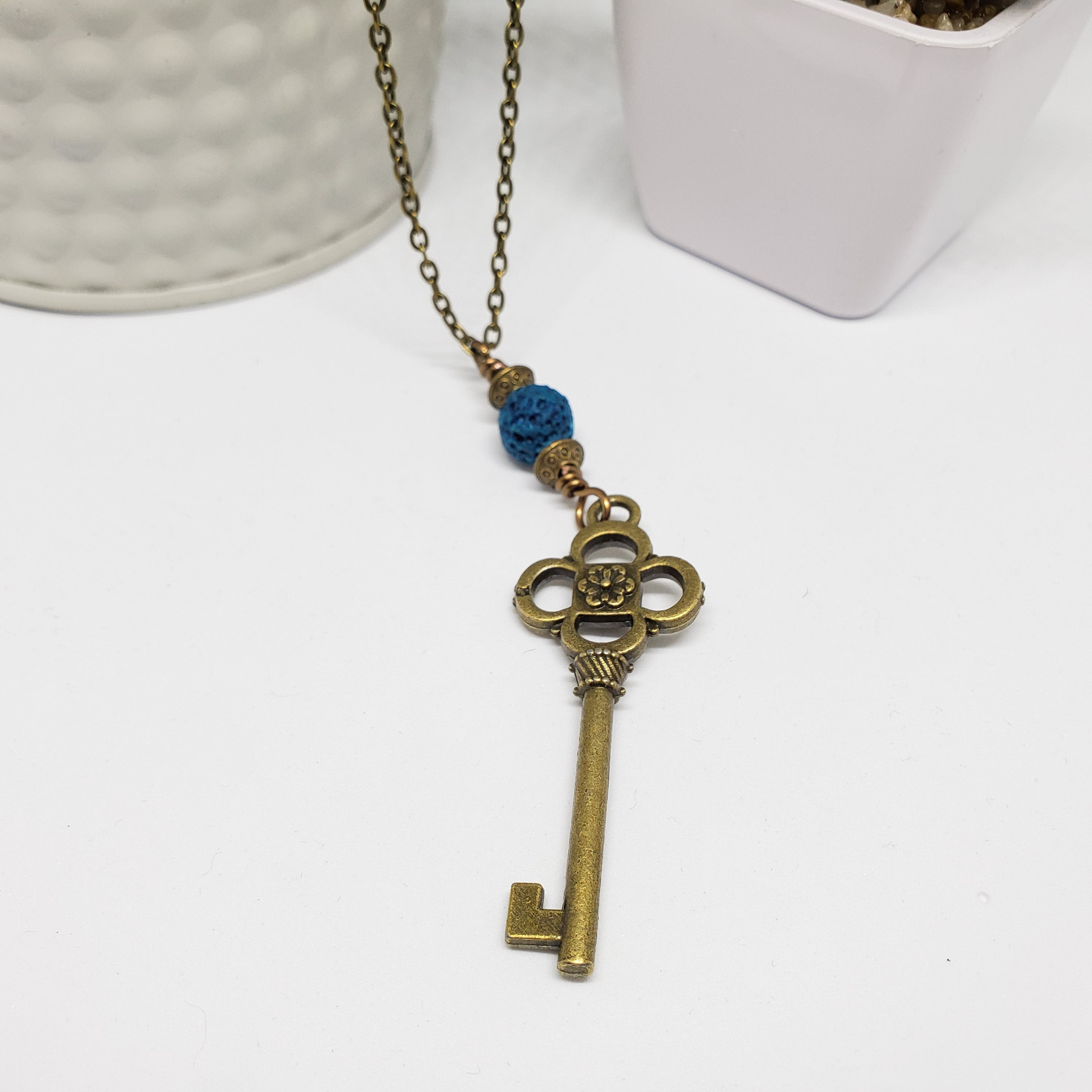 Antique Bronze Key with Blue Lava Bead