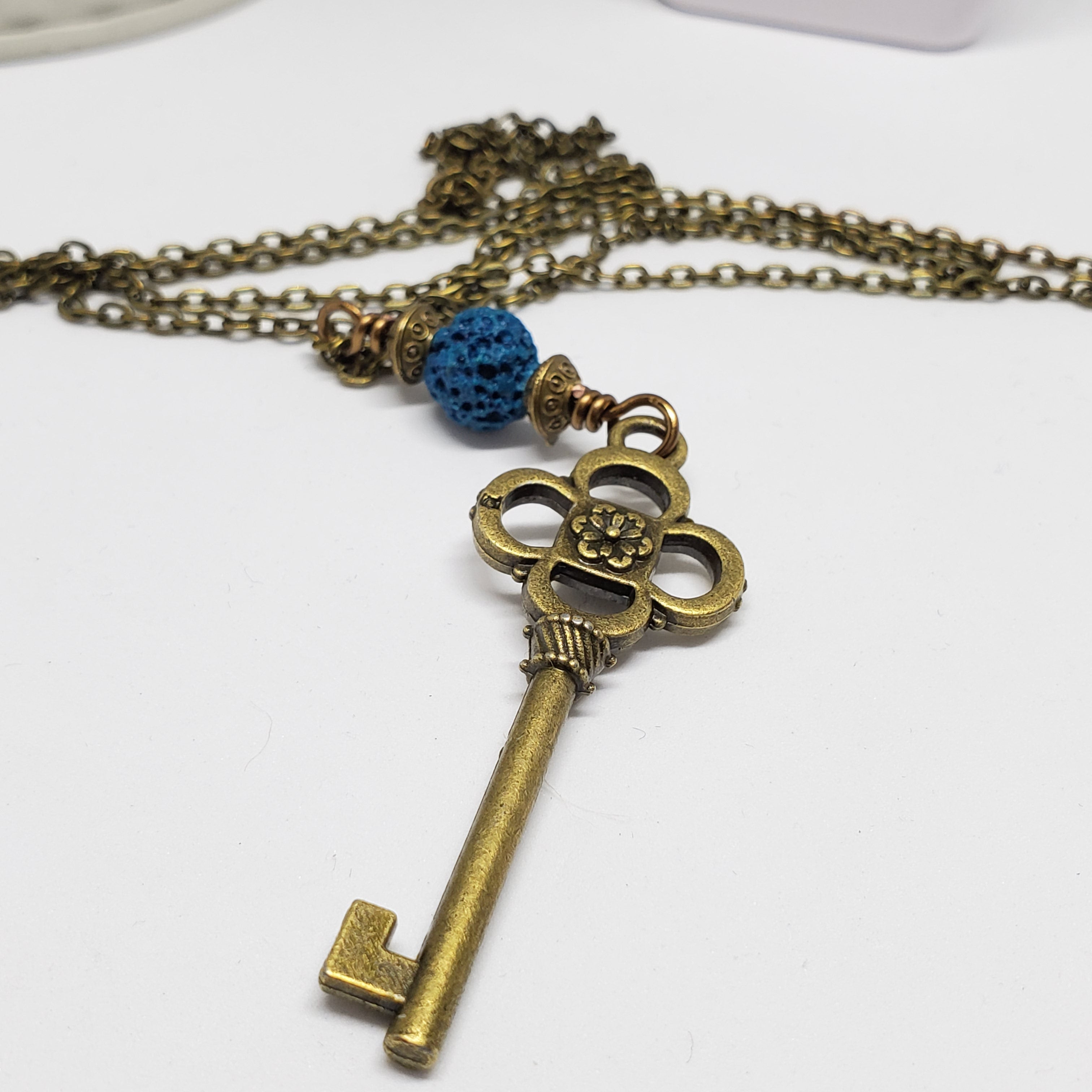 Antique Bronze Key with Blue Lava Bead