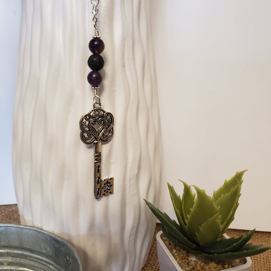 Key with amethyst and lava bead
