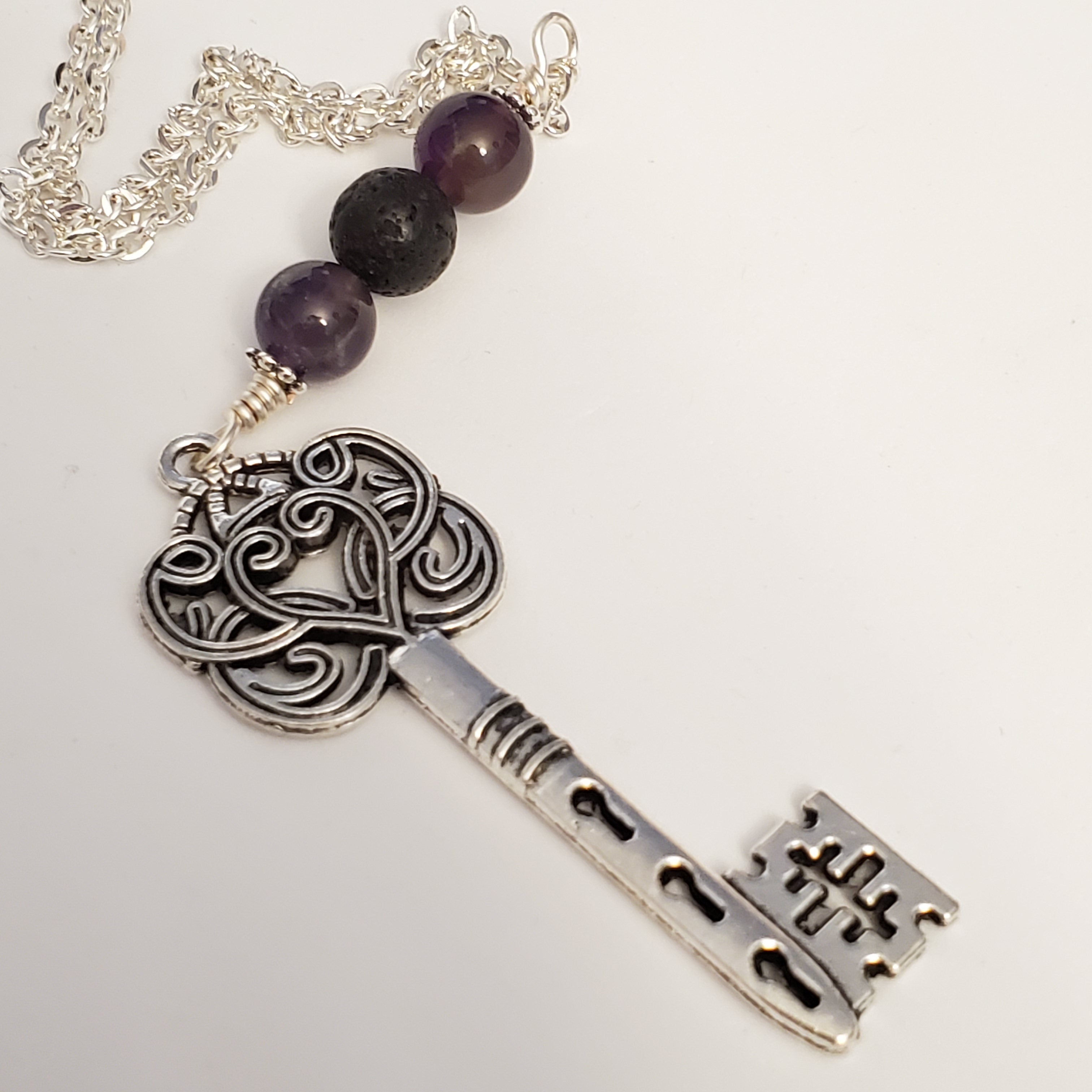 Key with amethyst and lava bead