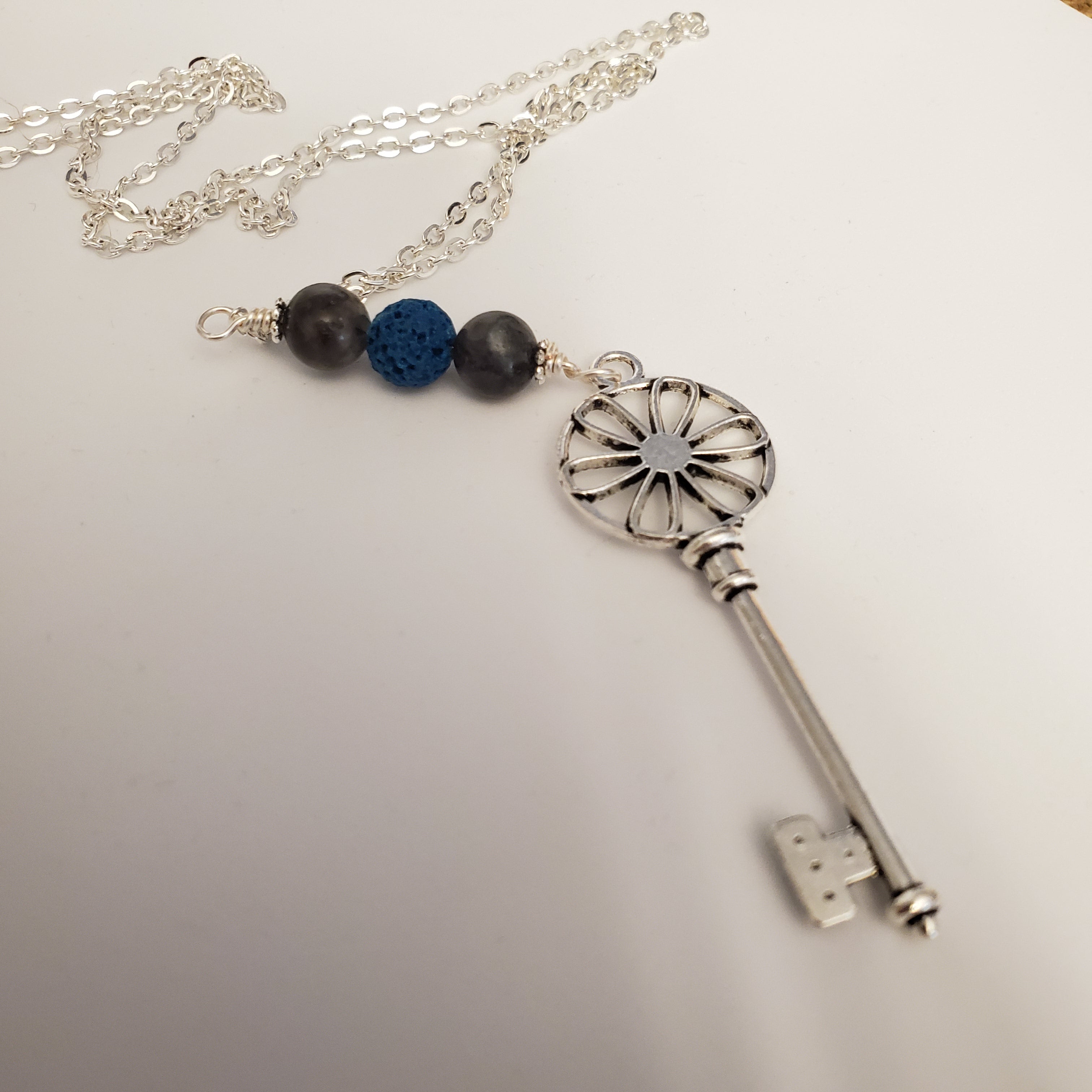 Key with blue lava bead and black labradorite