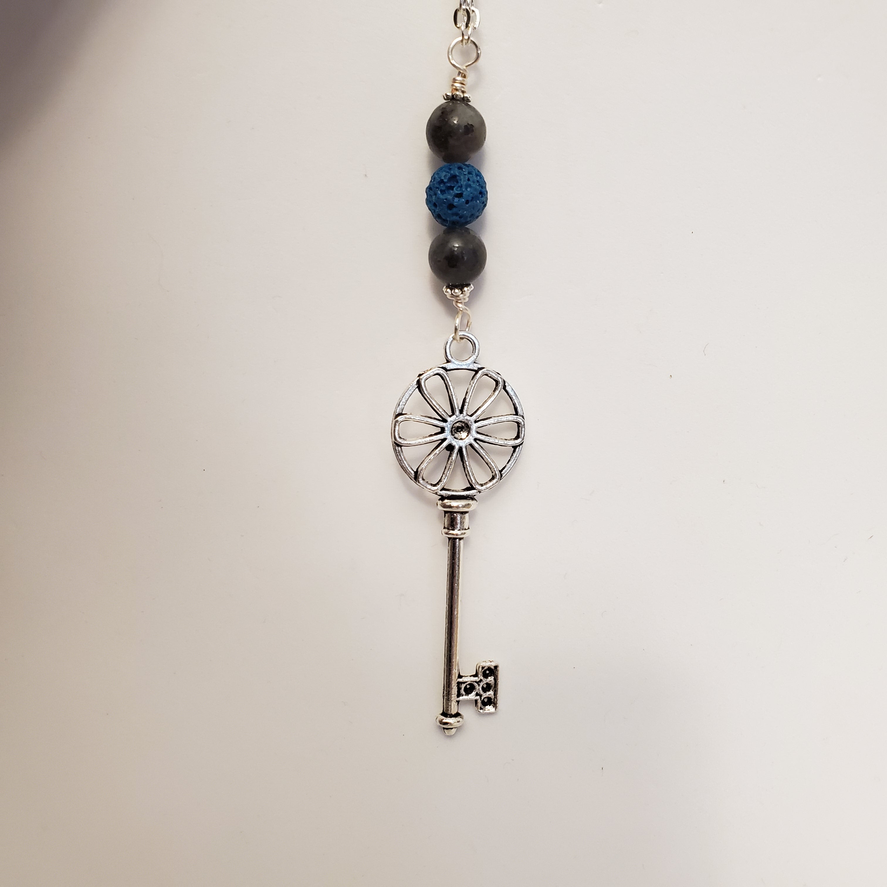 Key with blue lava bead and black labradorite