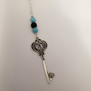 Key with black lava bead and blue amazonite